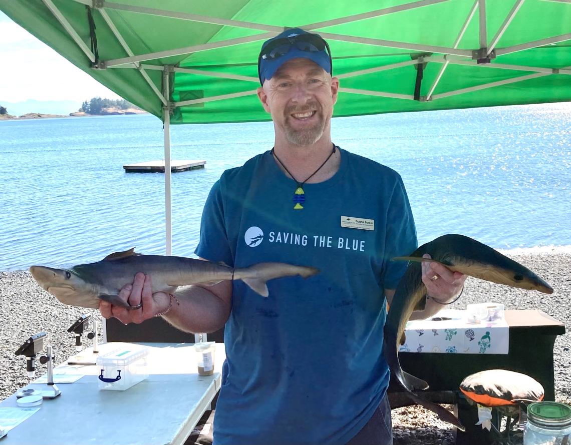 Dr. Duane Barker Dr. Duane Barker holding fish samples at the beach